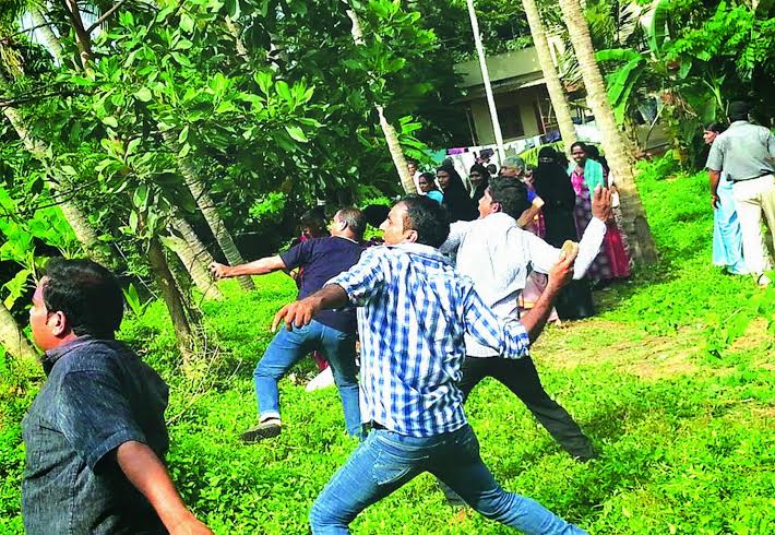 Villagers hurl stones at wind break-wall